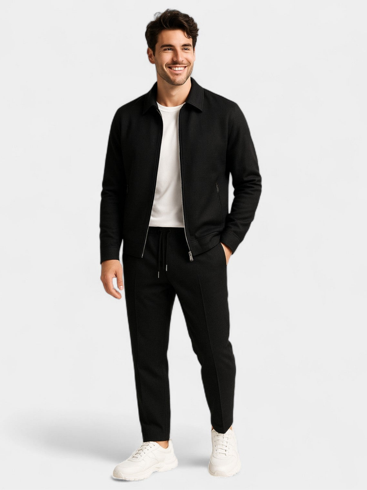 Full-length look at the black zip up jacket and jogger pants set