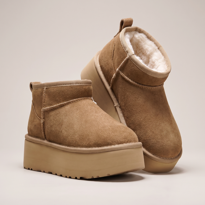 Chestnut mini platform boots with plush lining, pair shown from the side