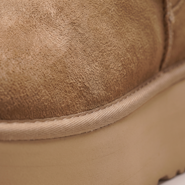 Close-up of the chestnut suede upper and thick platform sole