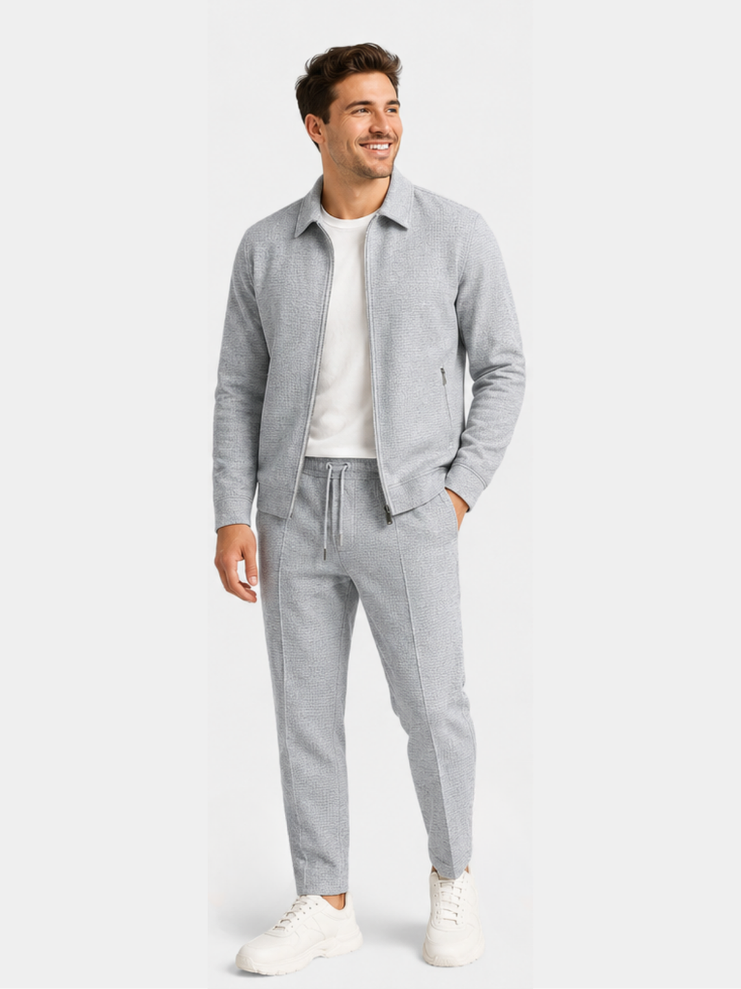 Gray tracksuit jacket and jogger pants styled with a white tee underneath