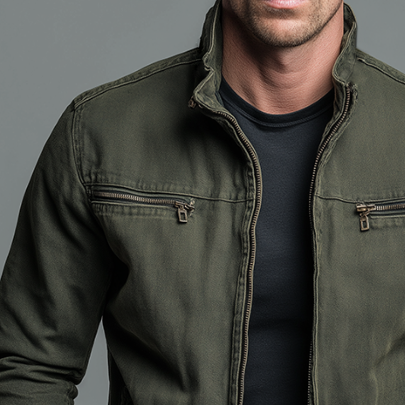 Close-up of the olive field jacket chest pockets and zip front