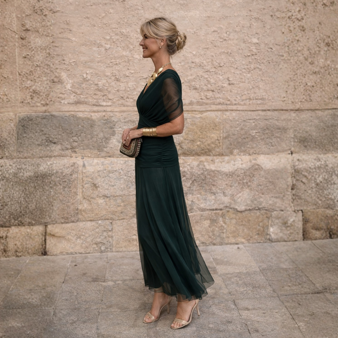 Emerald ruched maxi dress with sheer sleeves, side view