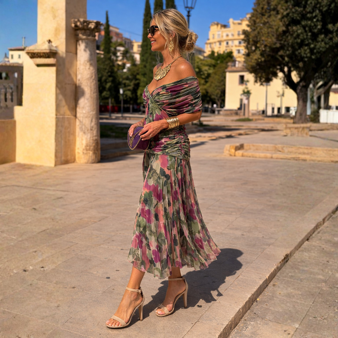 Floral ruched maxi dress in full length, worn with sunglasses and heeled sandals