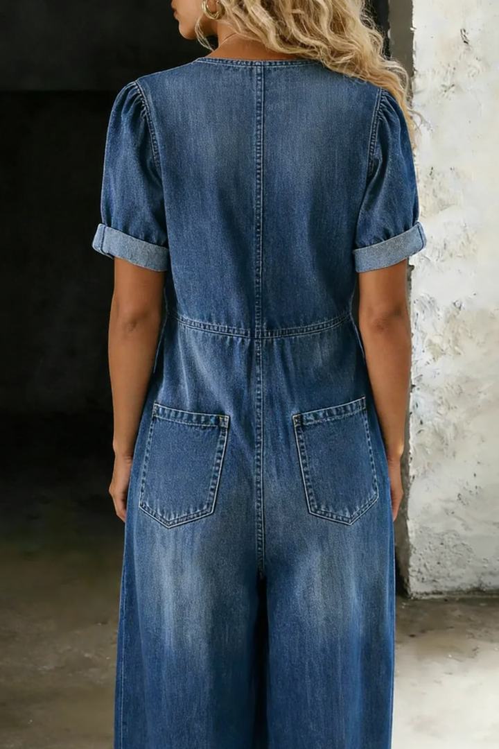 Back view of the blue denim-look jumpsuit with back pockets