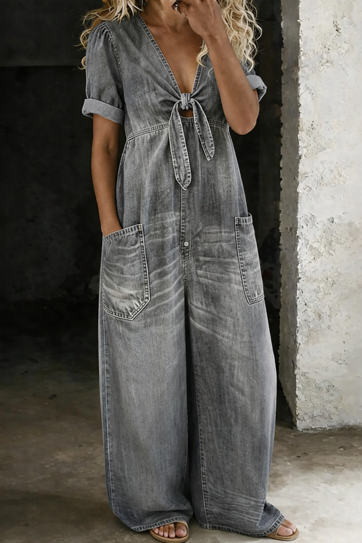 Gray wide leg jumpsuit with short rolled sleeves and front tie