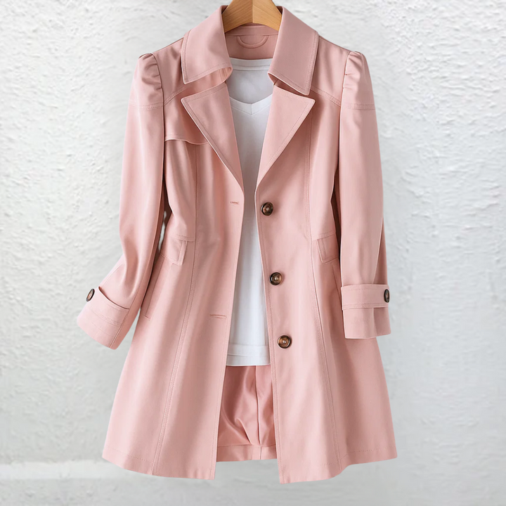 Blush pink trench coat with flared hem, shown on a hanger