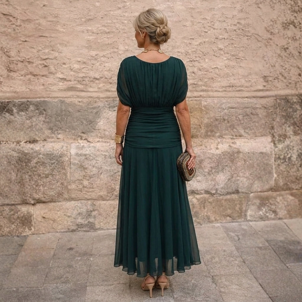 Emerald maxi dress with gathered back and sheer skirt, back view
