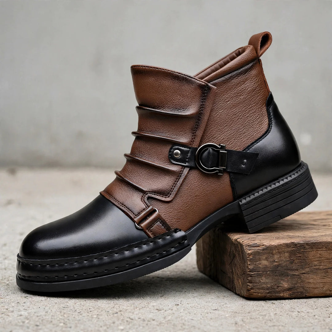 Brown and black two tone ankle boot with buckle strap, angled view on wood