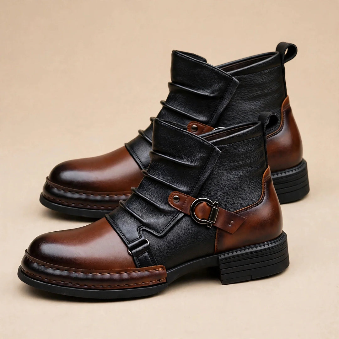 Two tone ankle boots with buckle straps and stitched welt on a beige background