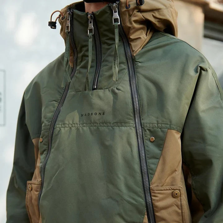 Olive colorblock anorak with chest pocket and side zip, close view on model