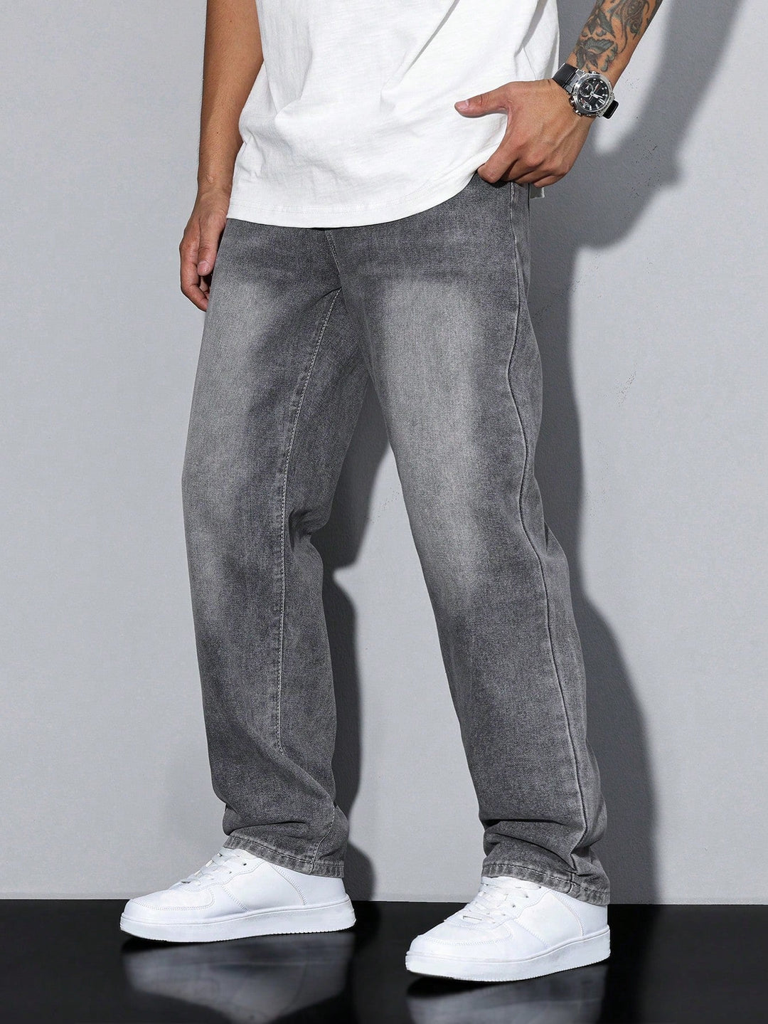 Men's gray baggy jeans, front view on a model