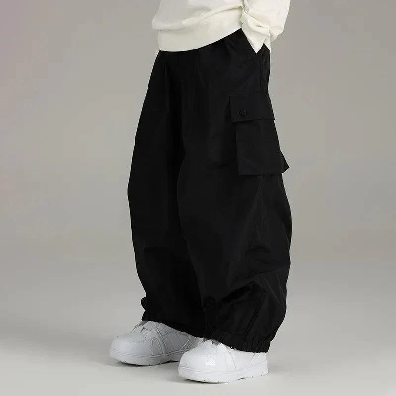 Men's baggy snow pants in black, wide leg ski pants with cargo pockets