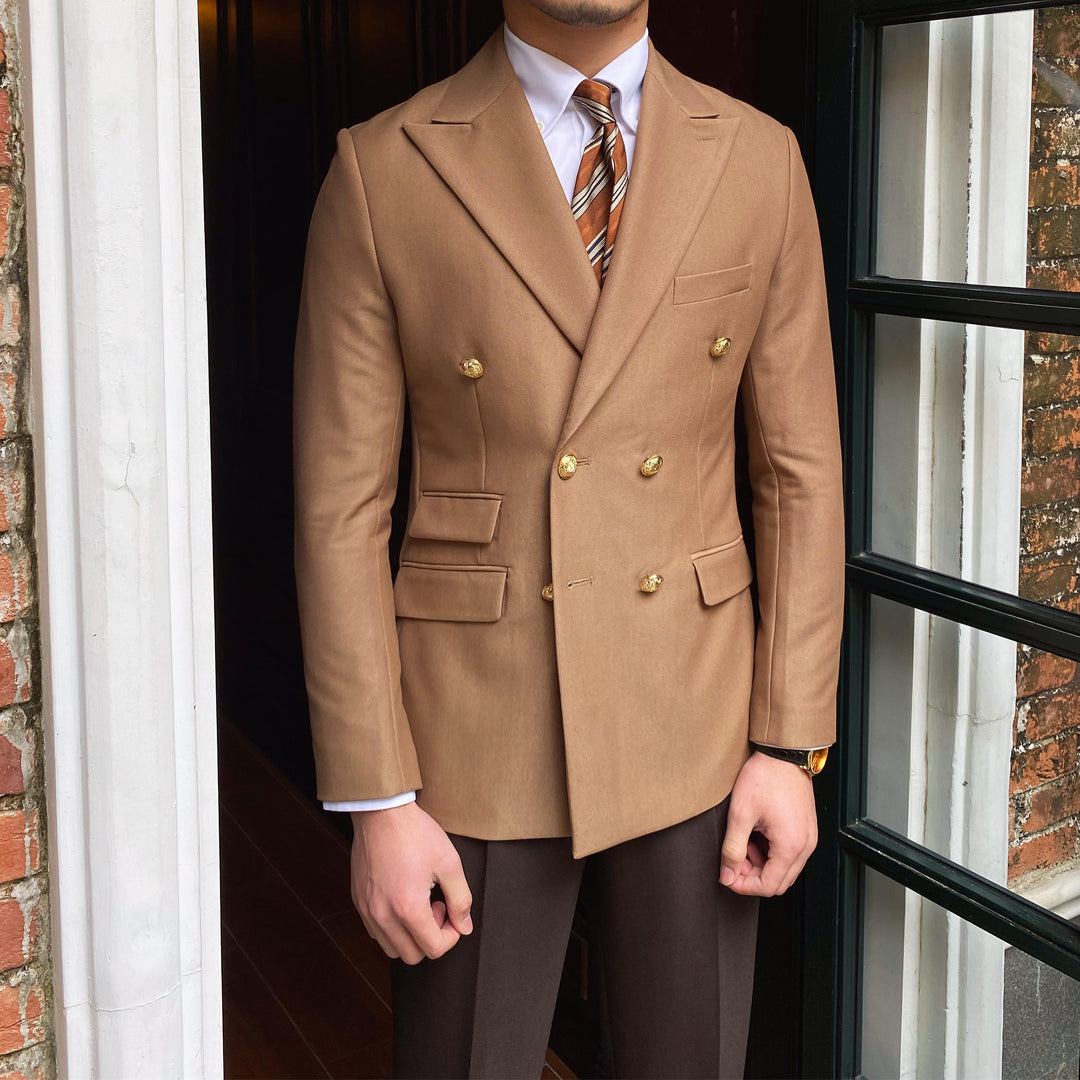 Camel double breasted blazer worn with brown trousers