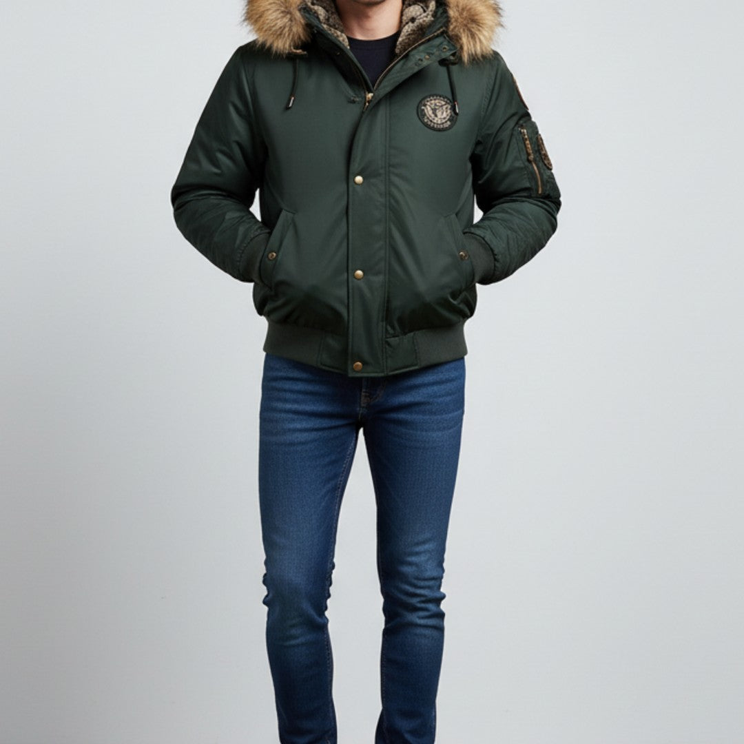 Man wearing the dark green bomber with blue trousers