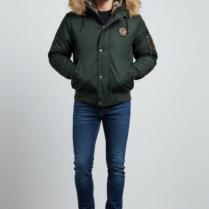Man wearing the dark green bomber with blue trousers