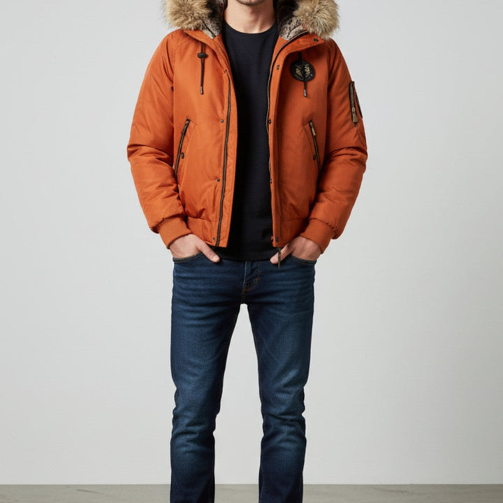 Man wearing the orange bomber over a black tee