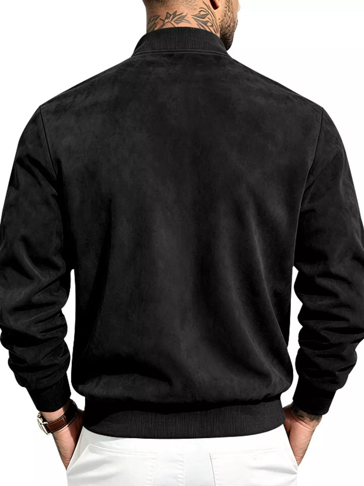 Back view of the black bomber jacket with a ribbed waistband
