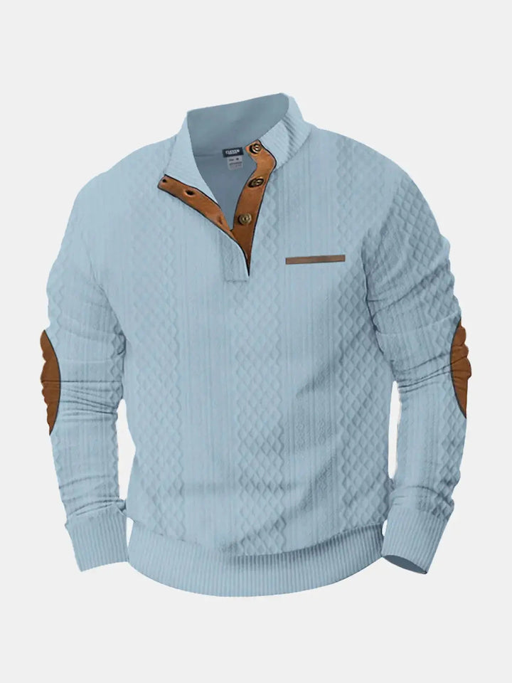 Light blue cable knit mock neck pullover with brown elbow patches, flat front view