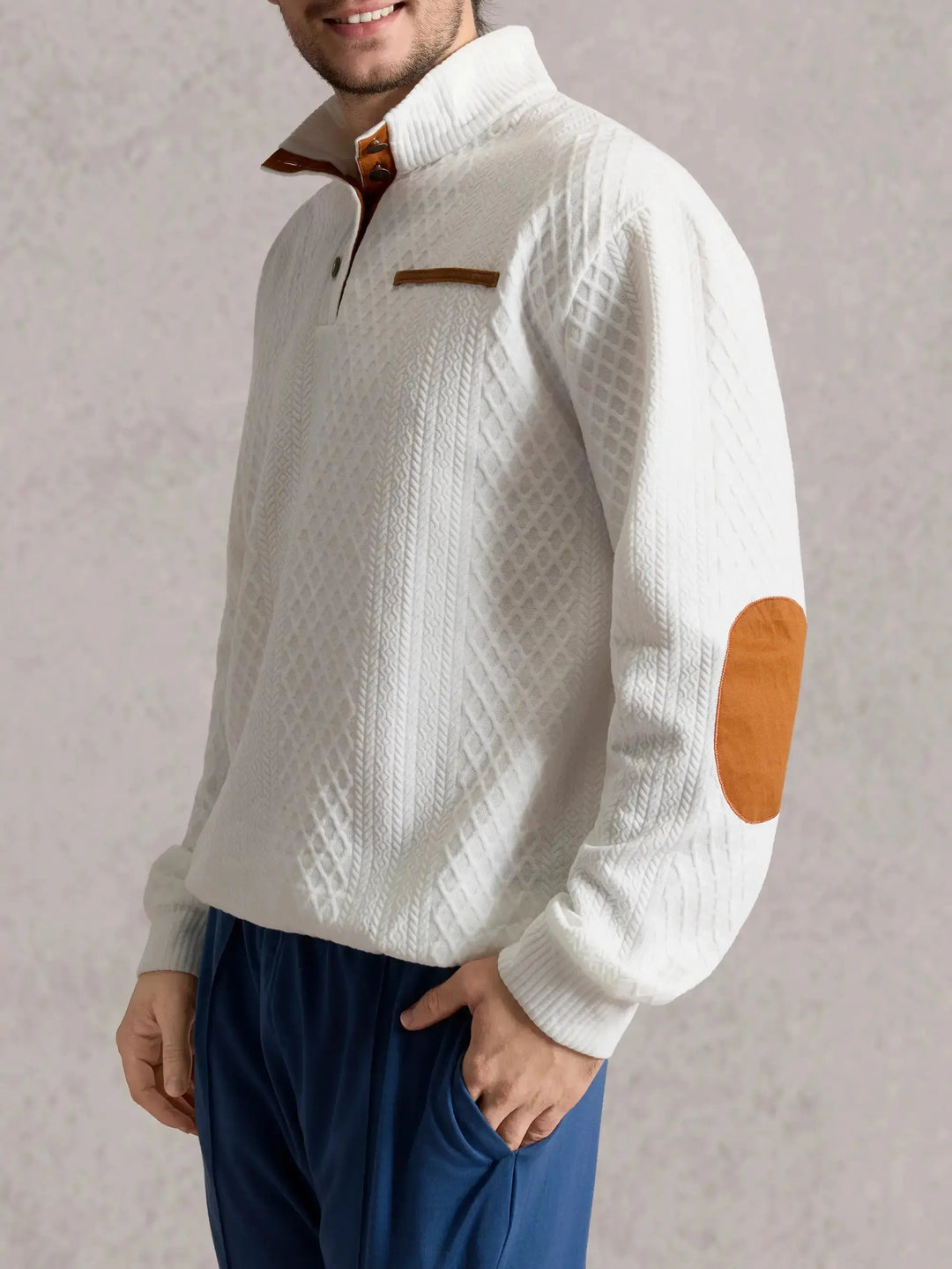 Side view of the white mock neck sweater on a model, showing the tan elbow patch