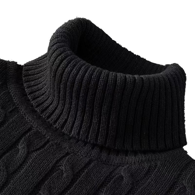 Close up of the black folded turtleneck and cable texture