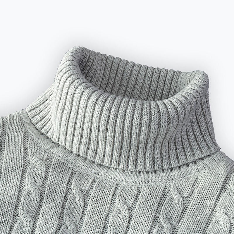 Close up of the light gray ribbed turtleneck and cable detail