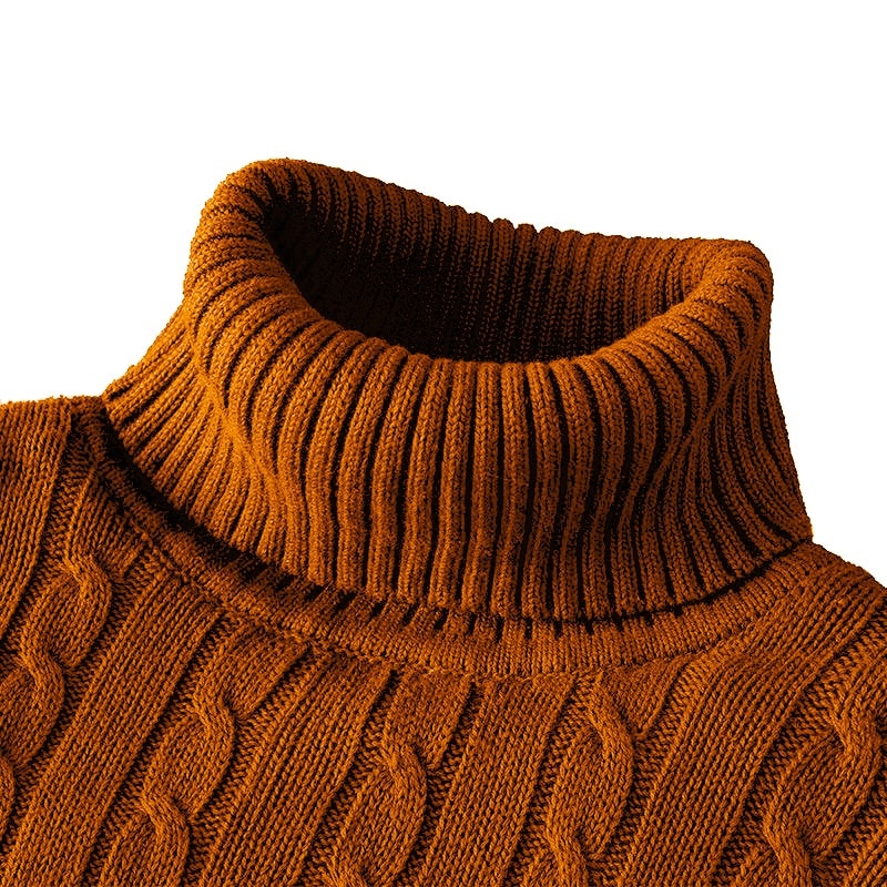 Close up of the rust ribbed collar above the cable pattern