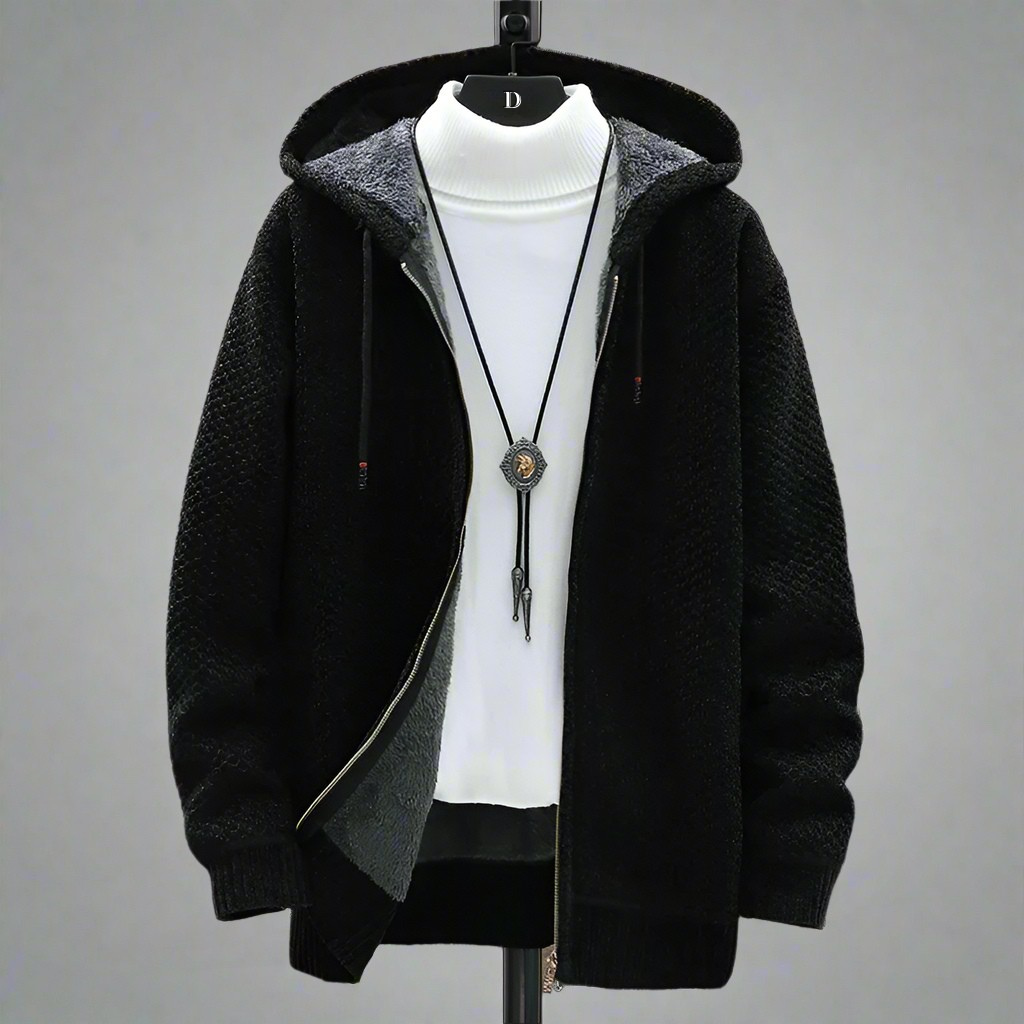 Black hooded zip up cardigan displayed open on a stand over a white top