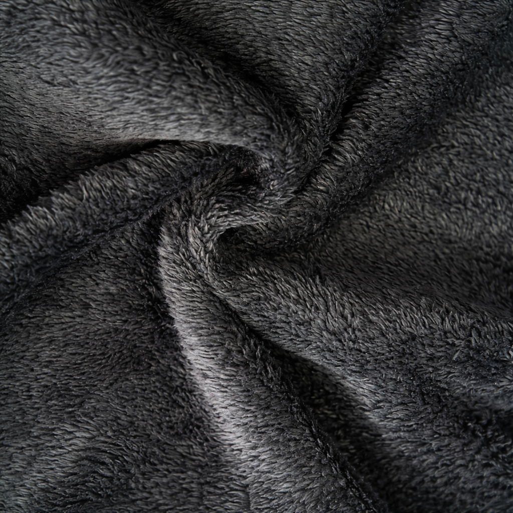 Close-up of the soft dark gray sherpa lining fabric inside the cardigan