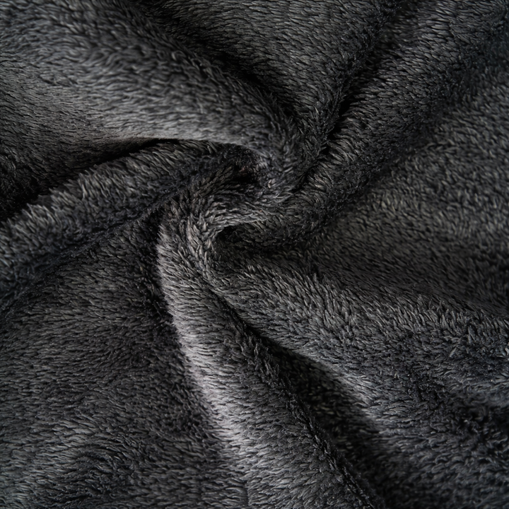 Close-up of the soft dark gray sherpa lining fabric inside the cardigan