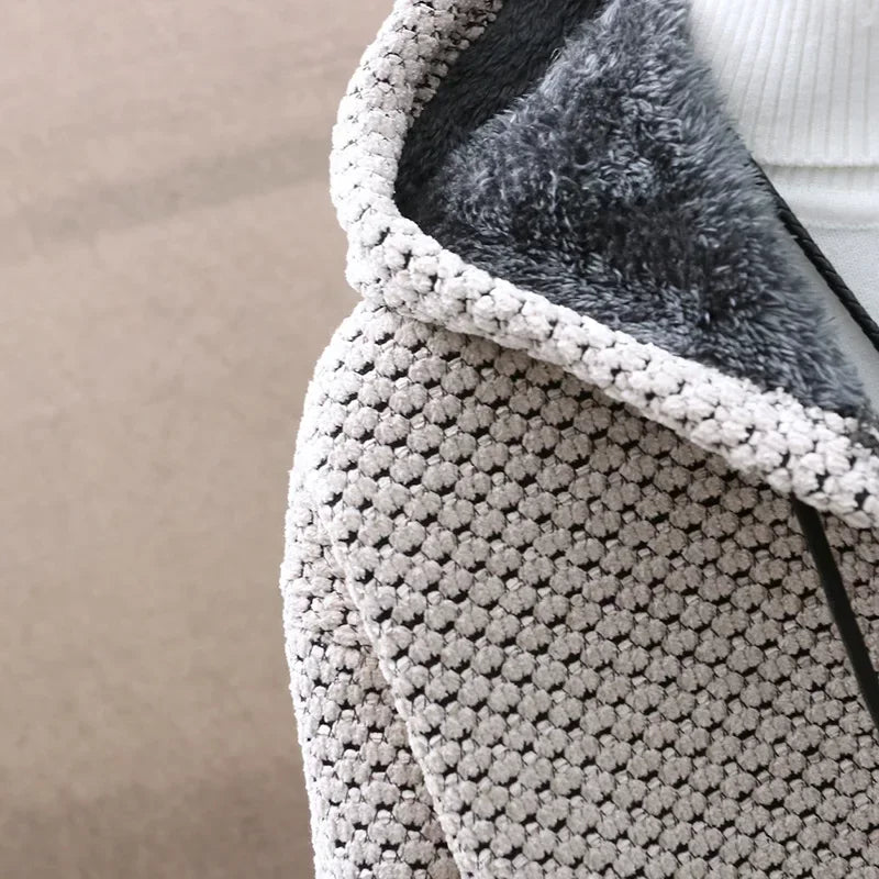 Close-up of the stone knit texture and fuzzy lining at the hood edge