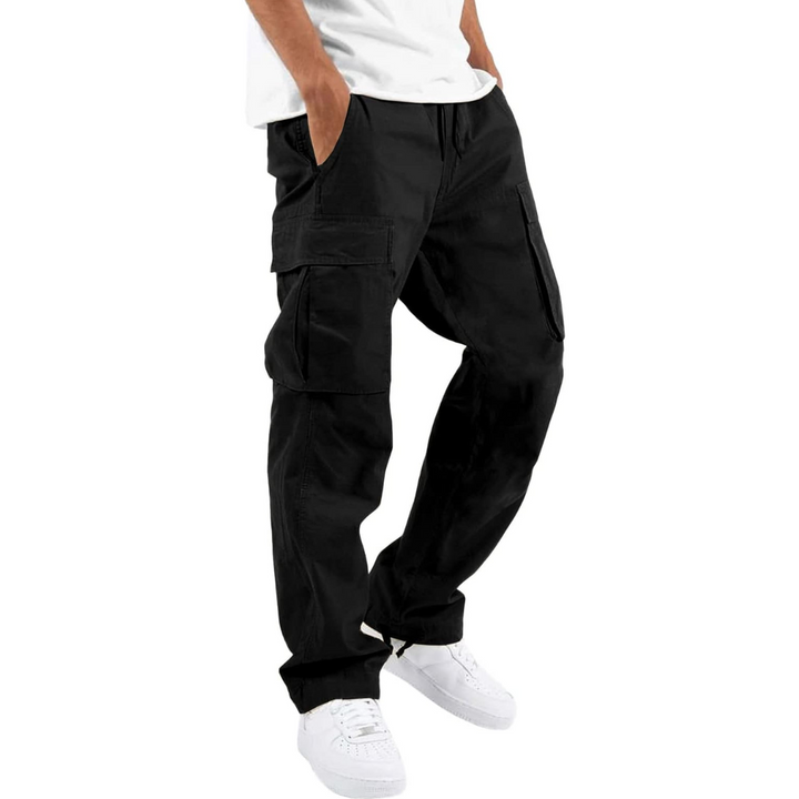 Black cargo pants with flap side pockets and white sneakers