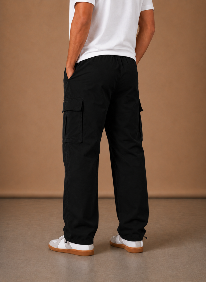 Side view of the black cargo pants with a relaxed leg