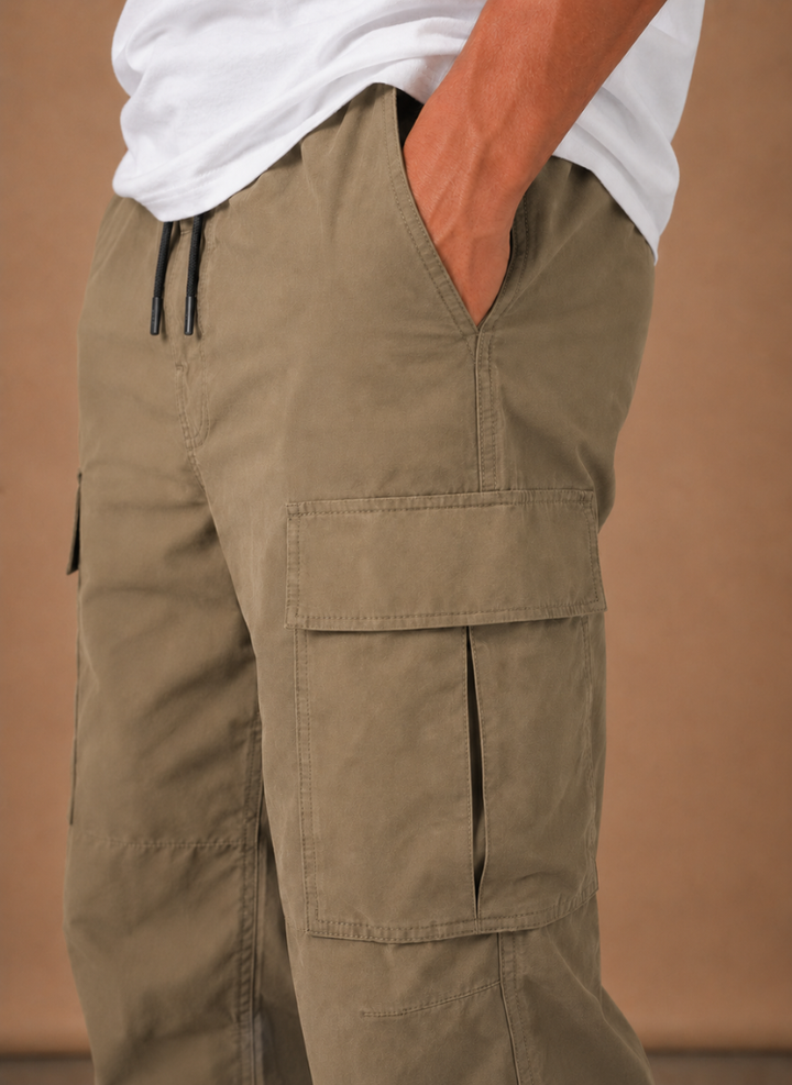 Close up of the khaki drawstring waist and cargo pocket