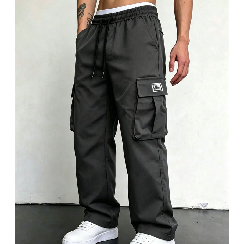 Charcoal wide leg cargo pants styled with white sneakers