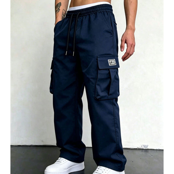Navy wide leg cargo pants styled with white sneakers