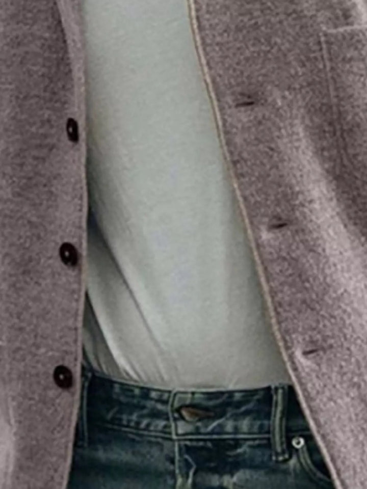 Close up of the taupe blazer front showing the buttons and textured surface