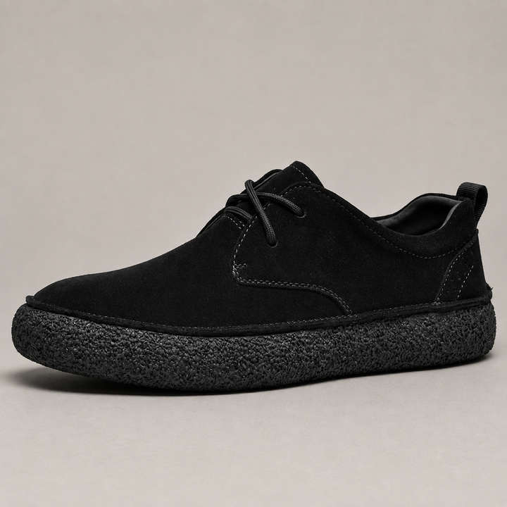 Black low top casual shoe with laces and chunky crepe sole, side view