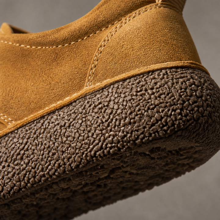 Close-up of the tan suede look upper and textured crepe sole