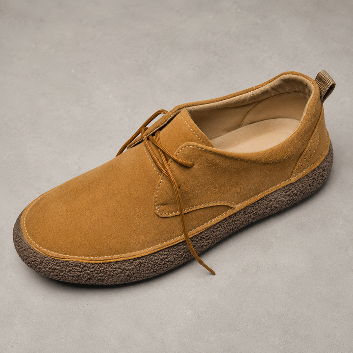 Tan low top shoe at an angle, showing the laces and cushioned insole