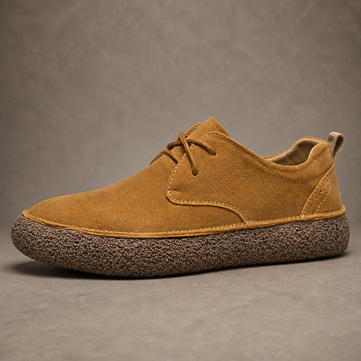 Single tan low top shoe with brown laces and thick crepe sole, side view