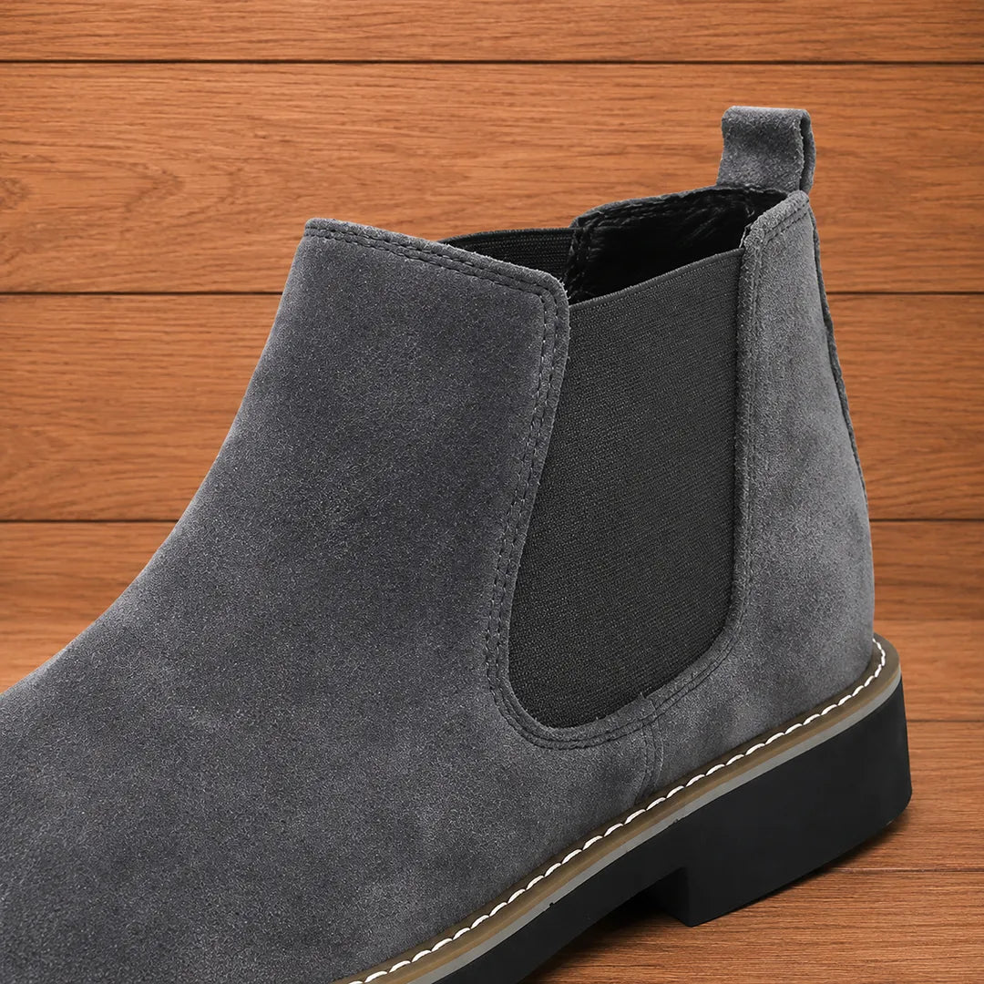 Close-up of the elastic side panel and pull tab on the gray boot
