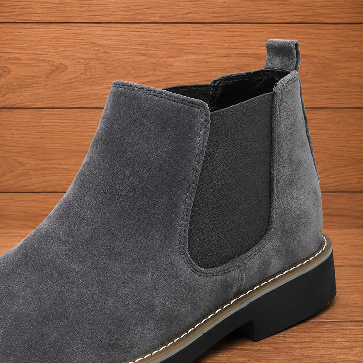 Close-up of the elastic side panel and pull tab on the gray boot
