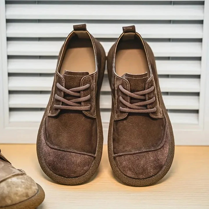 Pair of brown wide toe lace up shoes seen from the front
