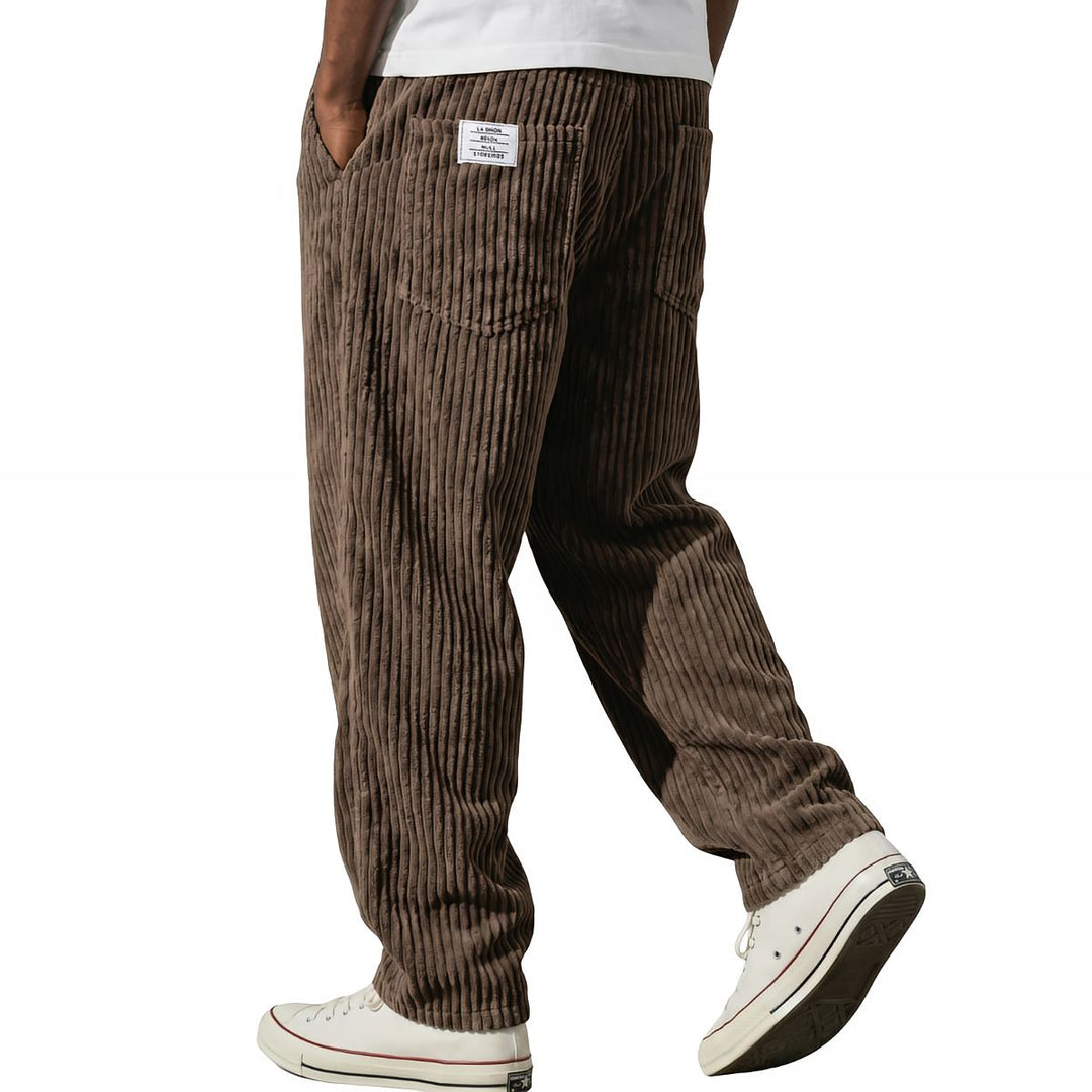 Brown corduroy pants in a relaxed straight leg, walking view