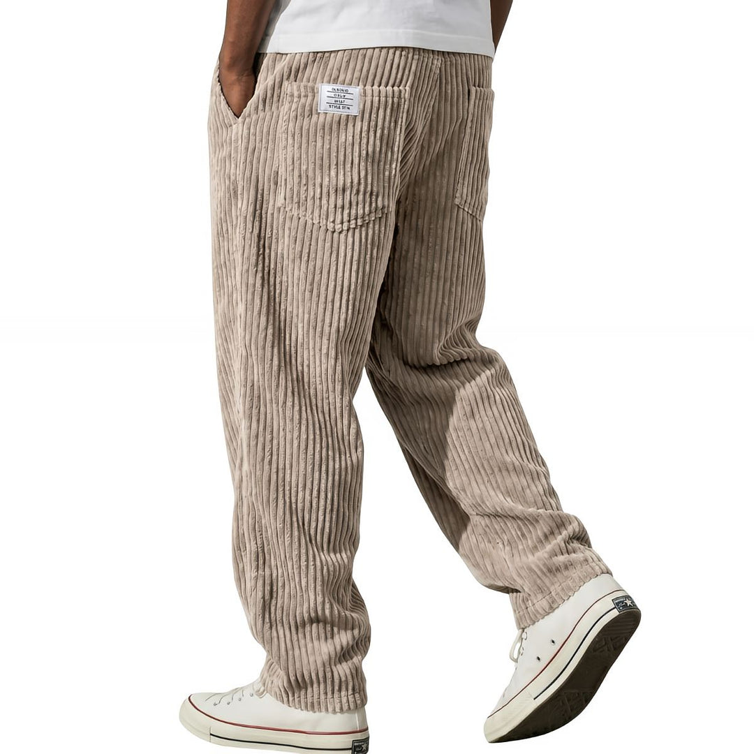 Khaki corduroy pants with elastic waist, walking side view