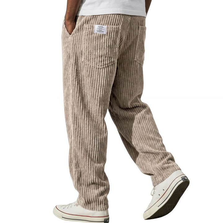 Khaki corduroy pants with elastic waist, walking side view