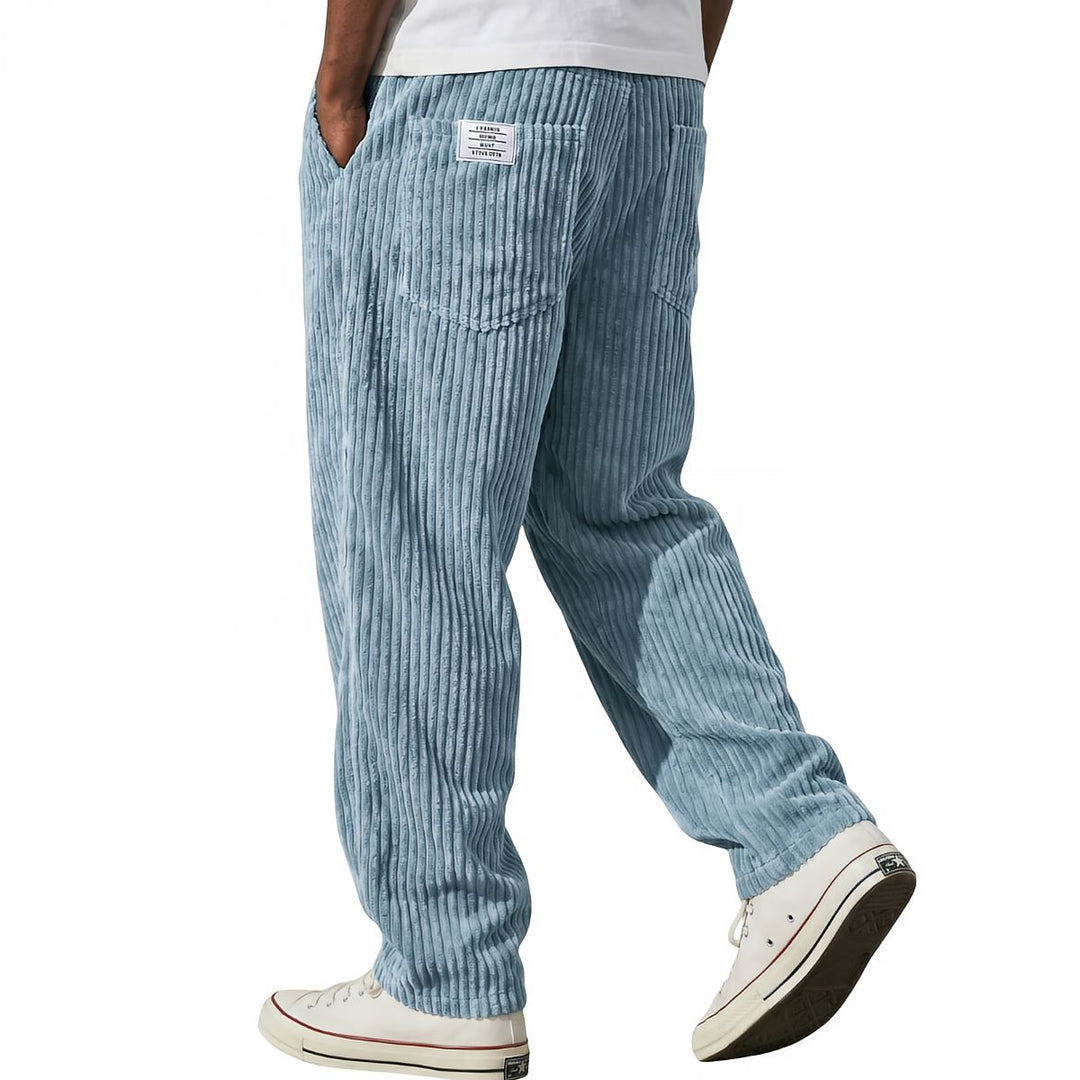 Light blue corduroy pants in a relaxed straight leg, side view