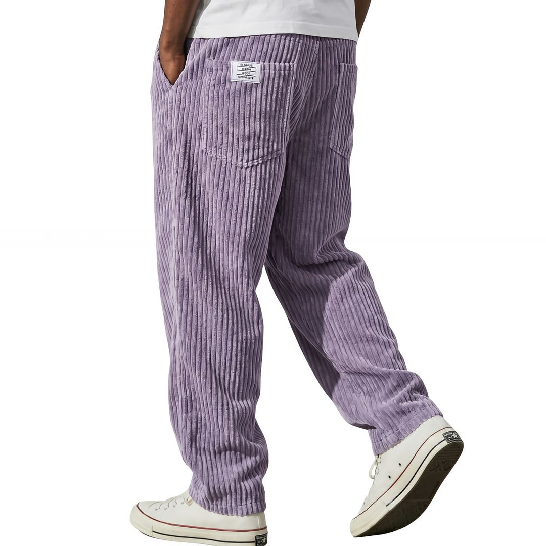 Lilac corduroy pants with white sneakers, walking side view