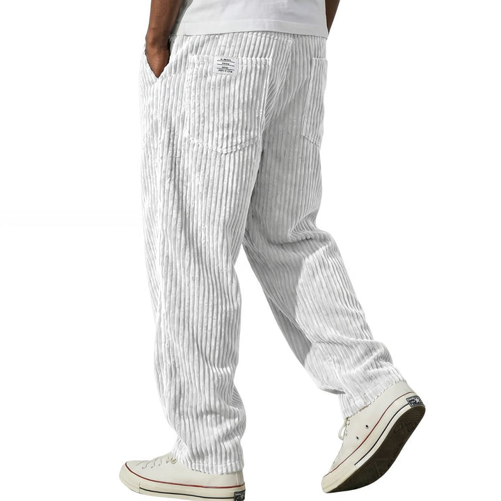 White corduroy pants with elastic waist, side walking view