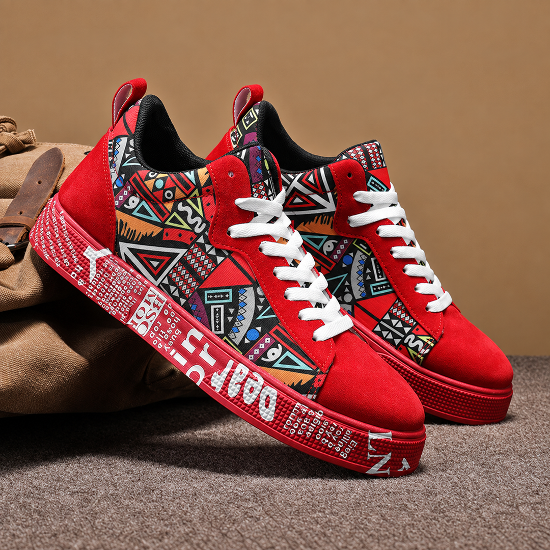 Pair of red graphic print court sneakers with white laces on a tan background